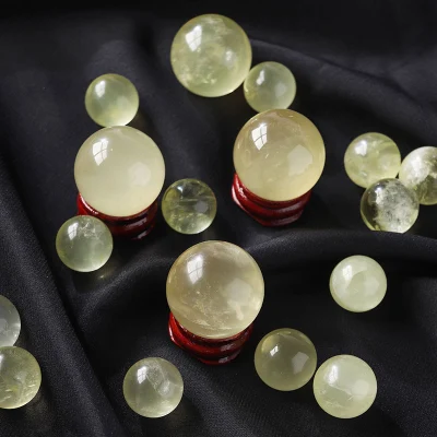 Boules de cristal sculptées à la main de topaze jaune de sphère de citrine naturelle pour la décoration